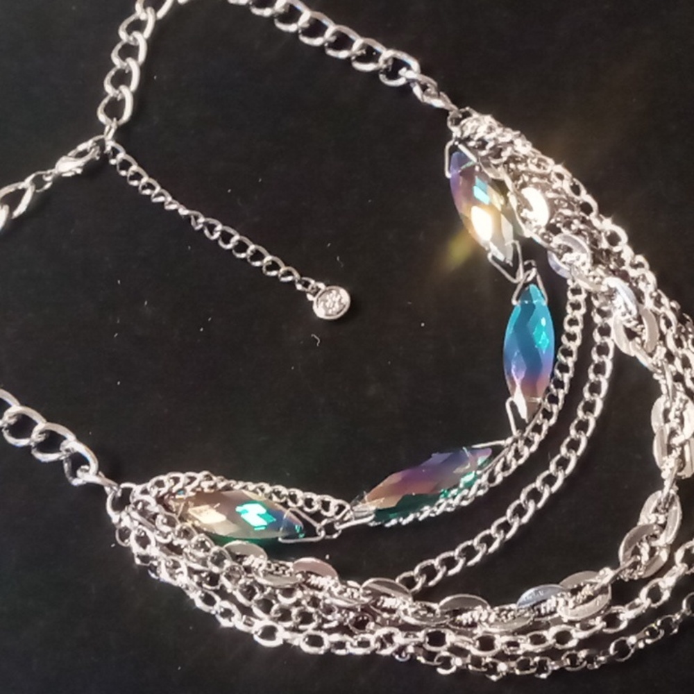 Vera wang layers chunky chain with a strand or iradecent carnival glass .